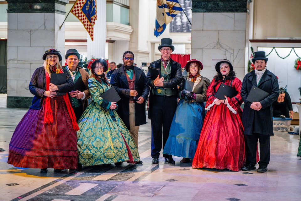 The Village Carolers singing at the Wannamaker Light Show