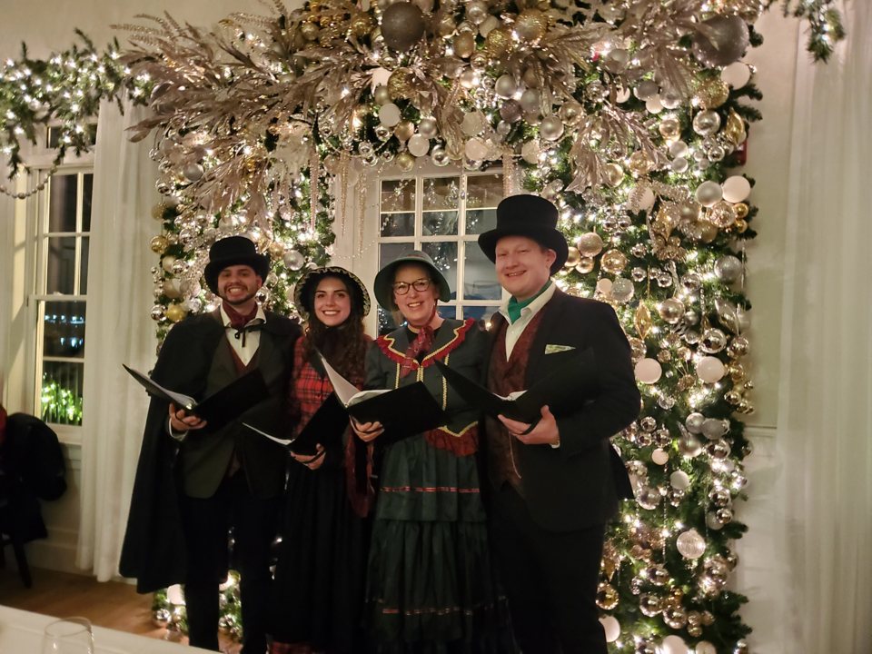 The Village Carolers singing at Charlie's